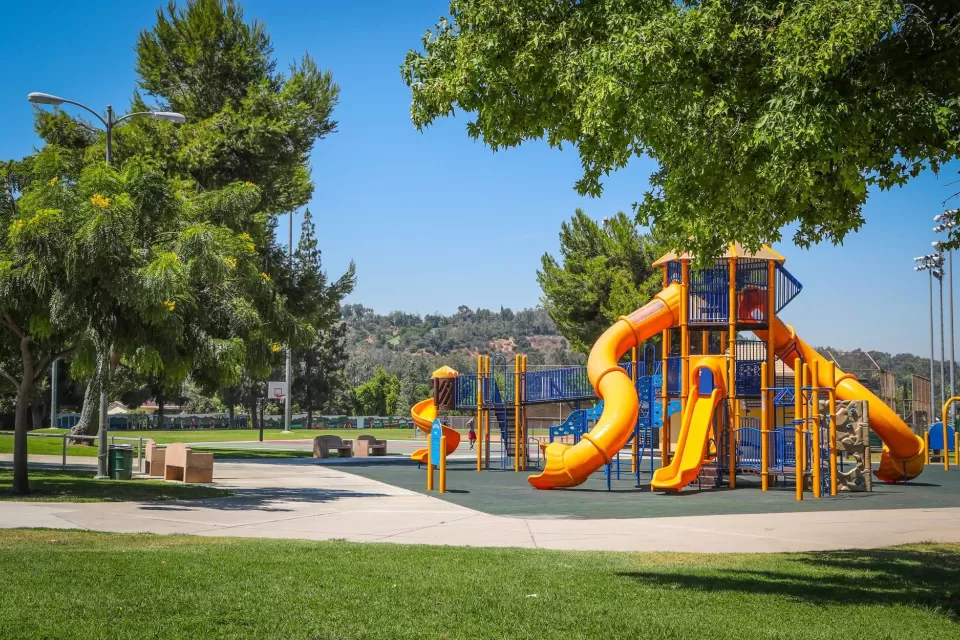 Playground with yellow slides in Rimgrove Park, Los Angeles County